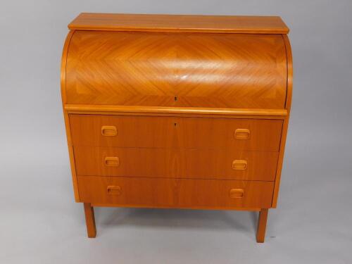 A Danish 1970's teak cylinder top bureau