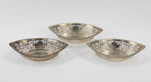 A set of three Edward VII silver boat shaped sweetmeat dishes