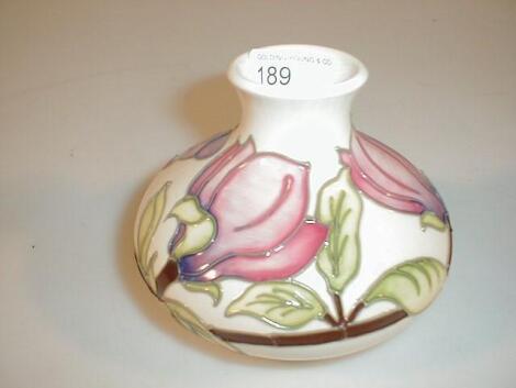 A Moorcroft small squat globular vase decorated with pink magnolias