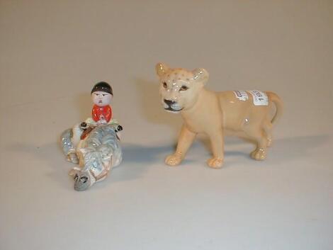 A Beswick model of a lion cub and a Beswick Thelwell model "Kick-start"