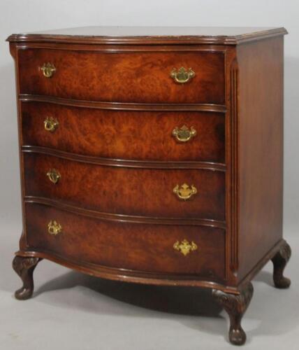 A mid 20thC walnut finish serpentine chest