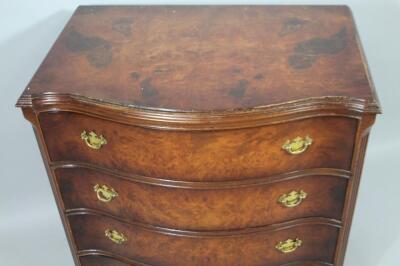 A mid 20thC walnut finish serpentine chest - 2