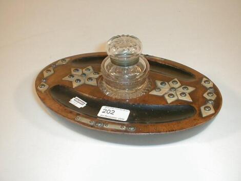 A Victorian oval ebonised and walnut desk stand with mother-of-pearl overlay