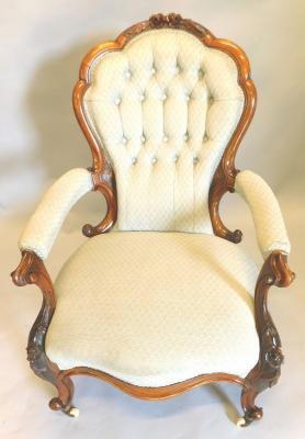 A Victorian walnut showframe open armchair