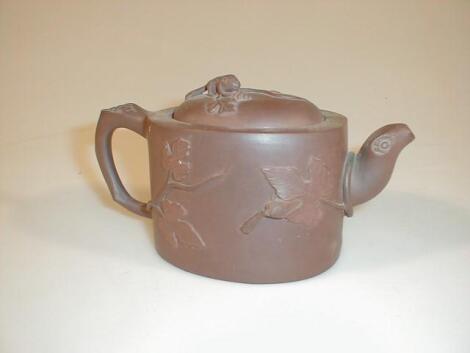 A late 19thC Chinese Yi Hsing red earthenware teapot modelled with fruiting