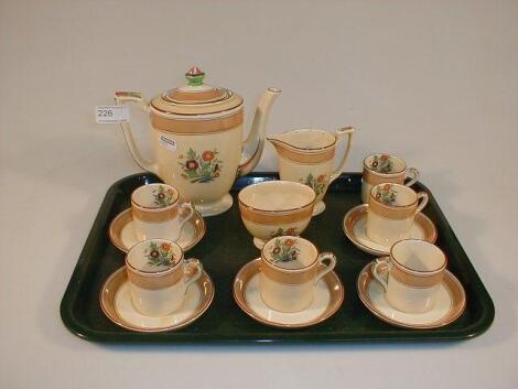 A Mintons coffee set, cream with brown banding and polychrome floral decoration