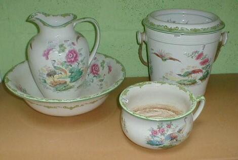 A toilet jug and bowl set with transfer printed Asiatic decoration and