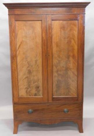 An early 19thC mahogany bow front armoire wardrobe