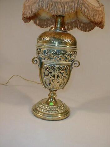 A Victorian pierced brass table oil lamp with detachable reservoir now