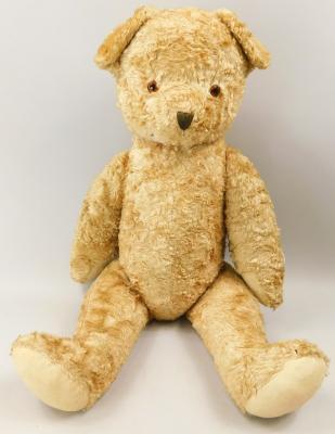 An English gold plush straw stuffed teddy bear