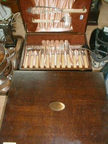 A pair of fish servers and fish eaters in fitted case and various cutlery in oak canteen