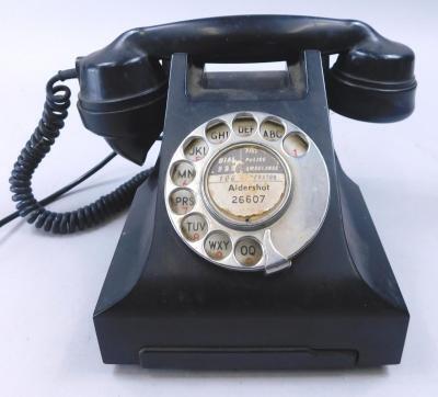 A 1950s black Bakelite telephone