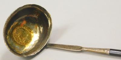 A 19thC white metal and twisted whale bone ladle