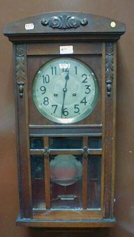 A 1930's mahogany wall clock