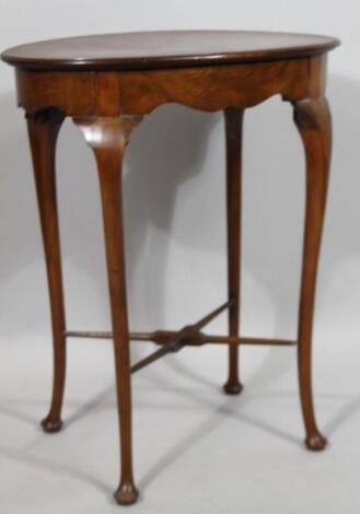 A 20thC walnut occasional table