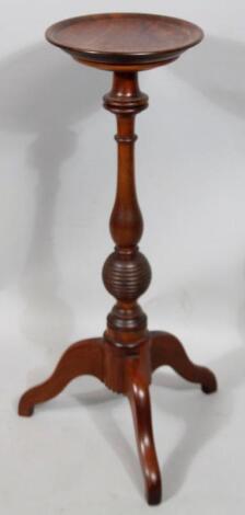 A 20thC mahogany torchere stand