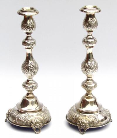 A pair of George V silver candlesticks