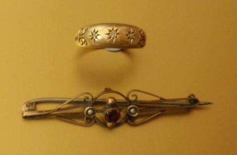 An Edwardian 18ct gold gypsy ring set with three diamond chips