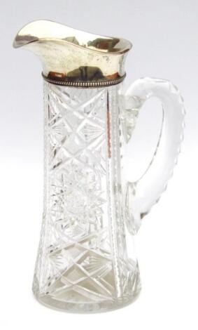 An early 20thC cut glass and silver water jug
