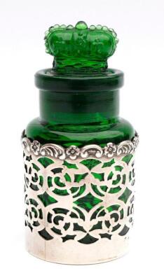 An Edwardian silver and green glass perfume bottle