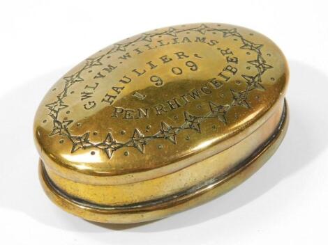 An Edwardian brass snuff box