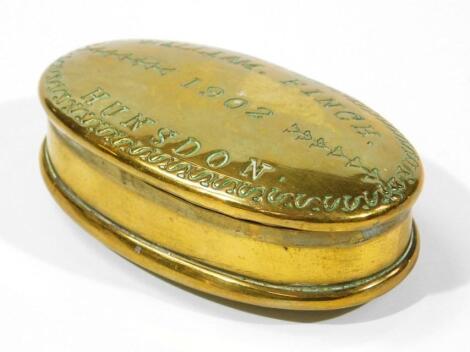 An Edwardian brass snuff box