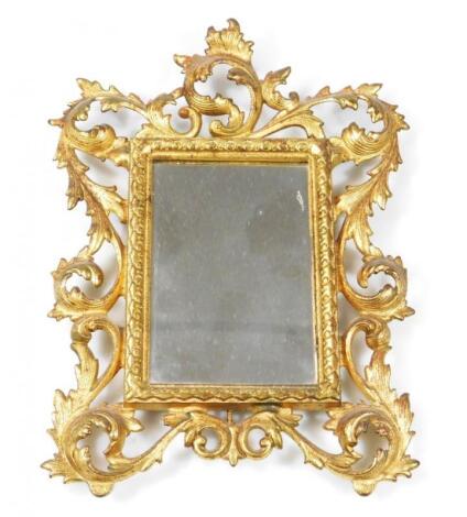 A rococo design cast metal mirror