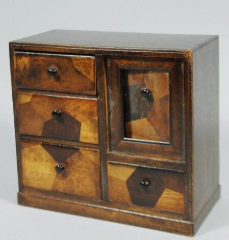 A 20thC marquetry tradesman's tabletop jewellery cabinet