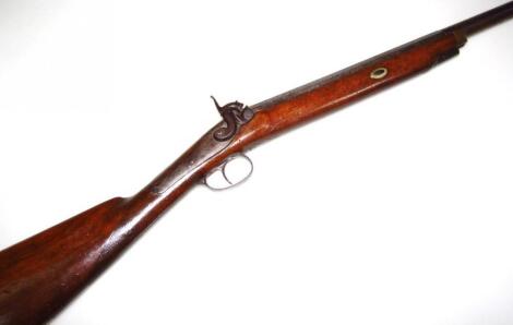 A 19thC percussion back action single barrel shotgun