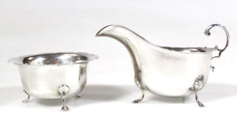 A matched two piece silver tea service