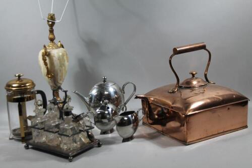 A 20thC silver plated six bottle cruet set