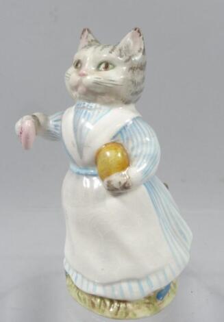 A Beswick Beatrix Potter gold oval figured Tabitha Twitchit