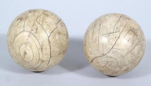 Two 19thC ivory orbs