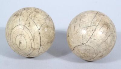 Two 19thC ivory orbs