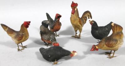 A set of seven unusual early/mid 20thC cockerel and hen ornaments