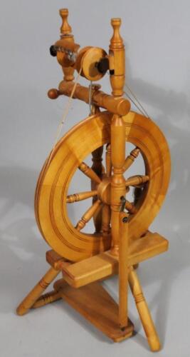 A modern light wood spinning wheel