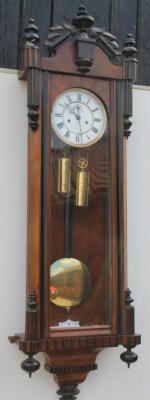 A late 19th/early 20thC Vienna walnut and ebonised wall clock