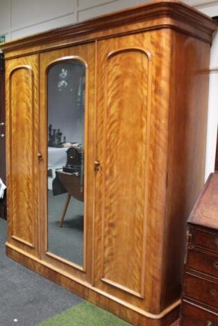 A Victorian satin birch triple wardrobe