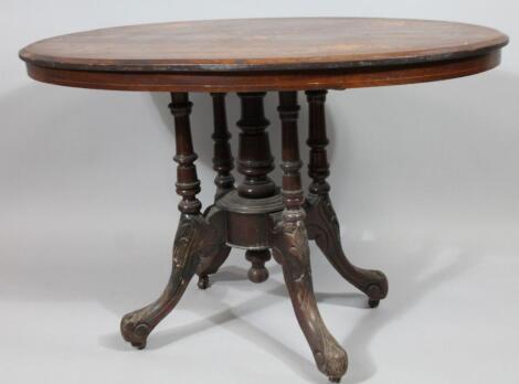 A Victorian walnut and marquetry oval breakfast table