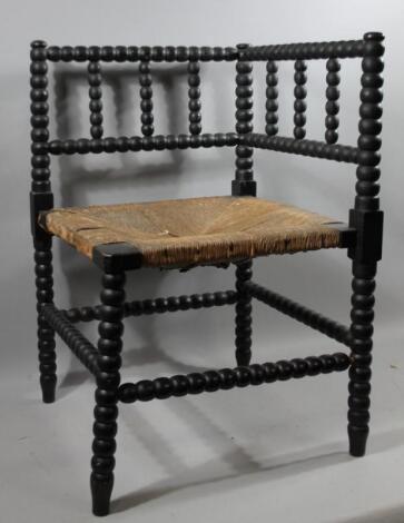 A late Victorian ebonised bobbin turned corner chair