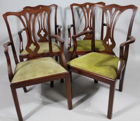 A set of four mahogany open armchairs