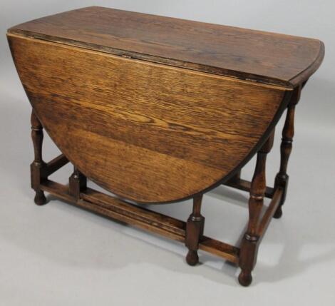 A 1920's oak gateleg table