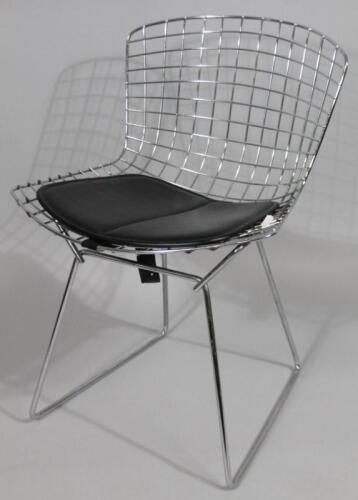 A Harry Bertoia designed chrome basket type chair