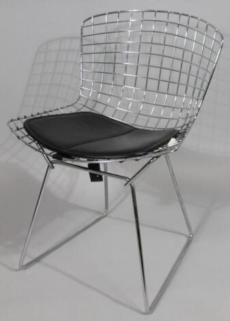 A Harry Bertoia designed chrome basket type chair