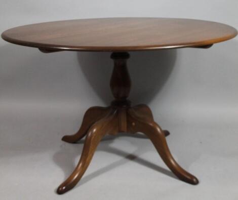 An Ercol dark wood dining table