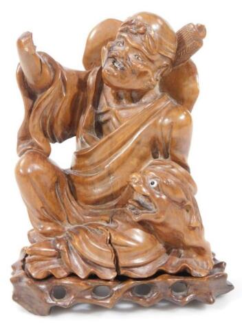 A Chinese Qing period carved wooden statue