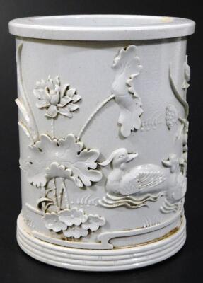 An ochre glazed brush pot