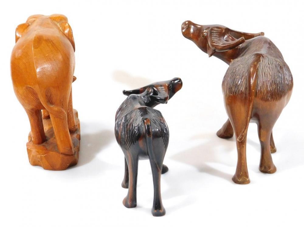 Three heavily carved 20thC wooden tribal figures