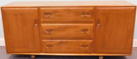 A light elm Ercol low sideboard