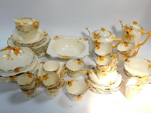 A Crown Ducal dinner tea and coffee service in the Sunburst pattern